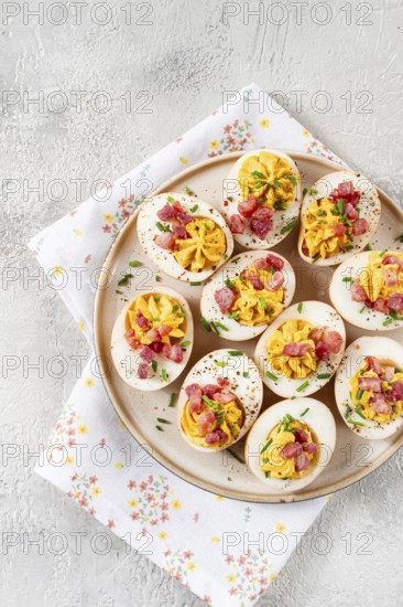 Spicy, stuffed ramen eggs, with bacon and green onions, homemade, no people