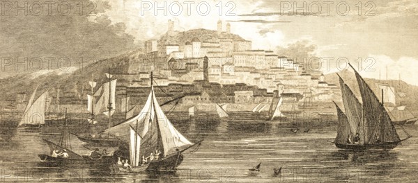 View of the city of Cagliary, island of Sardinia, Mediterranean Sea, Italy, sailboats, rowing boats, crew, full sails, houses on the mountainside, architecture, steel engraving, historical illustration 1834