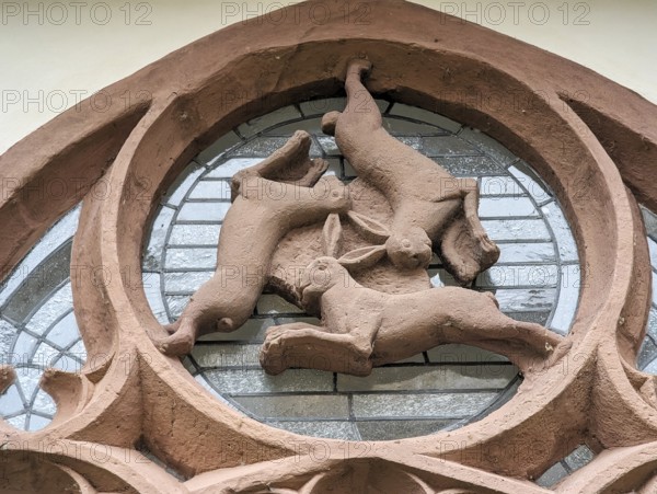 Hare window, three-hare window, optical illusion, three hares running in circles, ears, symbol of Holy Trinity, eternal cycle, famous landmark in the cloister, late Gothic, Paderborn Cathedral, Paderborn, Germany