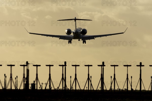 Gulfstream executive business jet aircraft in flight on approach to land at sunset at London Stansted airport, Essex, England, United Kingdom