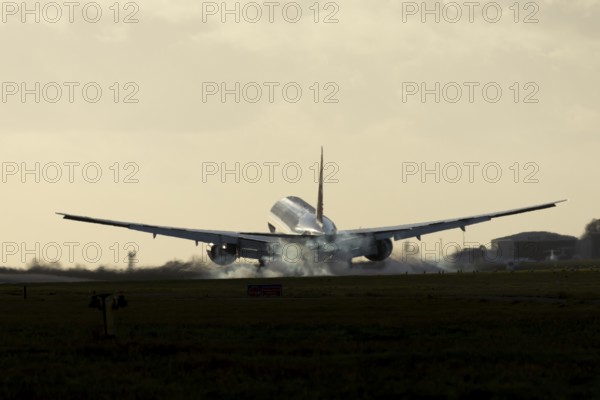 Boeing 777 A7-BFL commercial jet aircraft of Qatar cargo in flight landing on the runway at London Stansted airport, Essex, England, United Kingdom