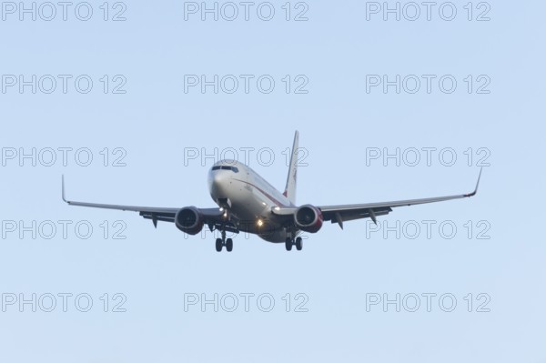 Boeing 737 commercial passenger airliner jet aircraft in flight on approach to land at London Stansted airport, Essex, England, United Kingdom
