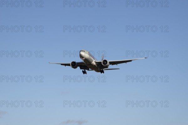 Boeing 777 commercial jet aircraft of Qatar cargo in flight on approach to London Stansted airport, Essex, England, United Kingdom
