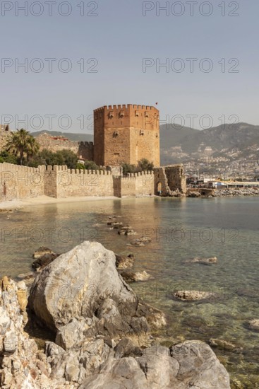 Alanya, Turkey. April 7th 2021 View of the Kizi Kule or Red Tower from the historic ancient castle walls, Alanya Harbour, on the Turkish Mediterranean, Turkey