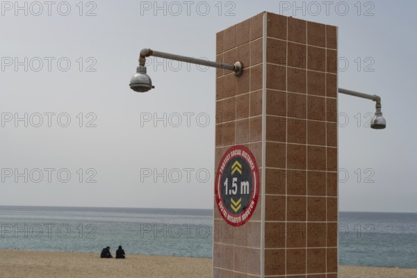 Alanya, Turkey. April 6th 2021 Social distancing instructions on a public shower on Kleopatra beach, Alanya, Turkey