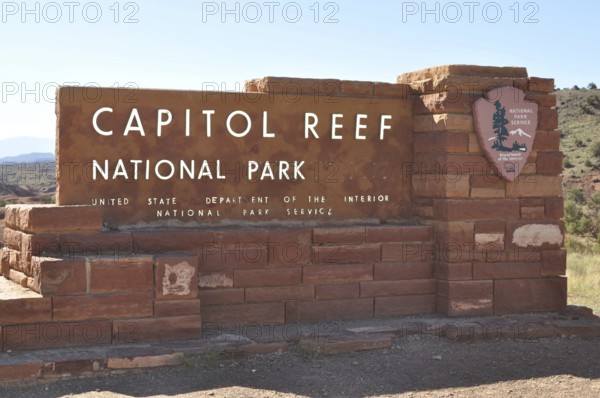 Capitol Reef National Park entrance sign, made of red bricks, surrounded by nature, Capitol Reef National Park, Utha, USA
