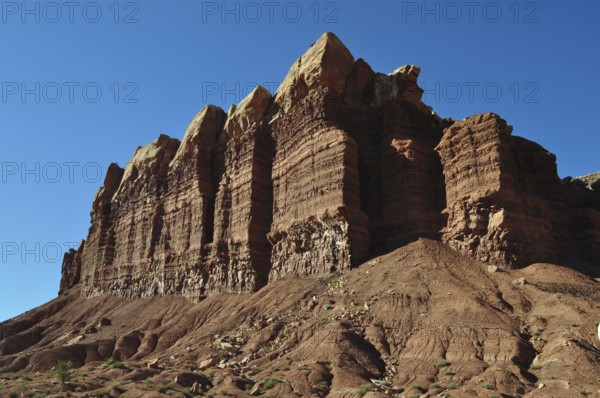 Distinctive rock structure with distinctive shapes against a deep blue sky characterized by erosion, Capitol Reef National Park, Utha, USA