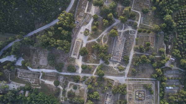 Olympic excavation site from high altitude, Temple of Zeus, Temple of Hera, Leonidaion, Palestra Philippeion, etc. Aerial view of ancient ruins between thick greenery and clear paths, drone shot, archaeological excavation site, Ancient Olympia, Olympia, Peloponnese, Greece