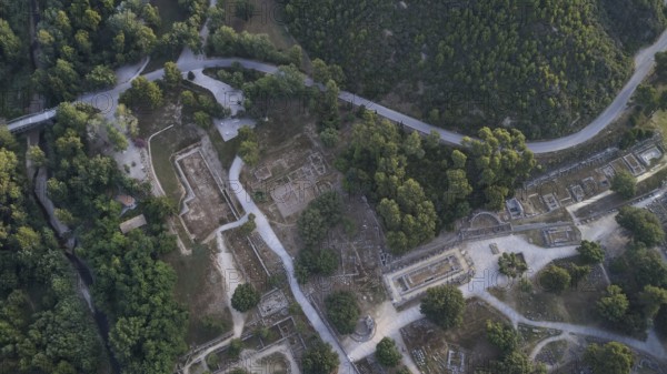Olympic excavation site from high altitude, Temple of Zeus, Temple of Hera, Palestra Philippeion, etc. Ancient ruins and trails nestled in a wooded landscape, from a bird's eye view, drone shot, archaeological excavation site, Ancient Olympia, Olympia, Peloponnese, Greece