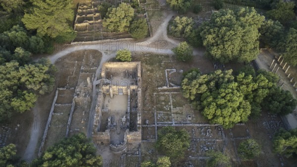 Workshop of Phidias and Early Christian Bailica, morning light, aerial view of an ancient ruined site, surrounded by trees and crossed by paths, drone shot, archaeological site, Ancient Olympia, Olympia, Peloponnese, Greece