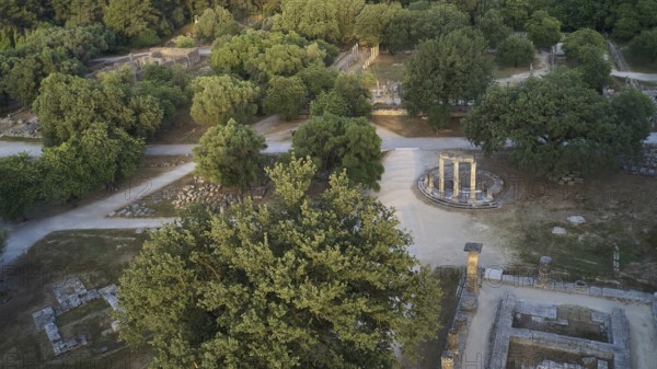 Soft morning light, Philippeion, part of the Temple of Hera, bird's eye view of ruins and trees, drone shot, archaeological site, Ancient Olympia, Olympia, Peloponnese, Greece