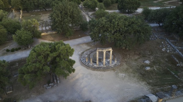 Philippeion, overview of ancient ruins and dense trees, drone photo, archaeological site, Ancient Olympia, Olympia, Peloponnese, Greece