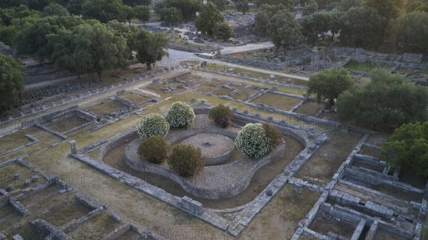 Leonidaion, complex with ruins and symmetrical stone structures surrounded by green vegetation, drone shot, archaeological site, Ancient Olympia, Olympia, Peloponnese, Greece