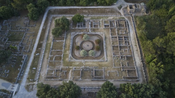Soft morning light, Leonidaion, square ancient ruins with blooming trees in the middle, drone shot, archaeological site, Ancient Olympia, Olympia, Peloponnese, Greece