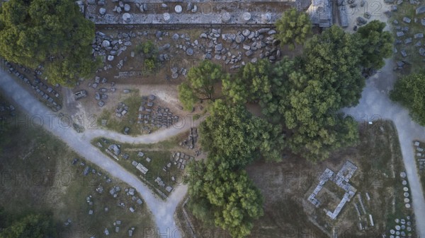 Temple of Zeus, Temple of Zeus, Old Stone Structures Scattered Between Trees and Small Paths, Drone Shot, Archaeological Site, Ancient Olympia, Peloponnese, Greece