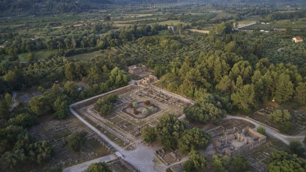 Soft morning light, Leonidaion, workshop of Phidias and early Christian Bailica, Heroon, Theocoleon, wide view of an archaeological site in the forest, drone shot, archaeological site, Ancient Olympia, Olympia, Peloponnese, Greece