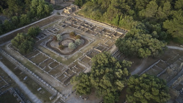 Leonidaion in morning light, aerial view of a rectangular ruin surrounded by trees at sunset, drone view, archaeological site, Ancient Olympia, Peloponnese, Greece