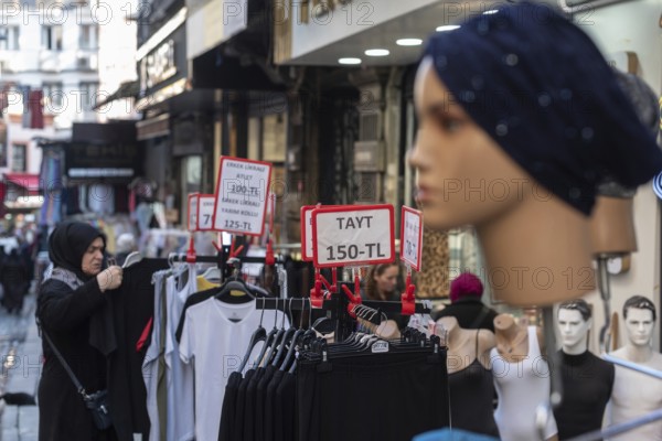 Istanbul, Turkey 7th January 2025. Local shoppers browsing clothes reduced in price in a popular textile bazaar in the Fatih district of Istanbul, Turkey