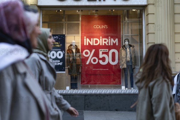 Istanbul, Turkey 7th January 2025. 50% Sale prices displayed in shop window in a busy shopping street in Istanbul, Turkey