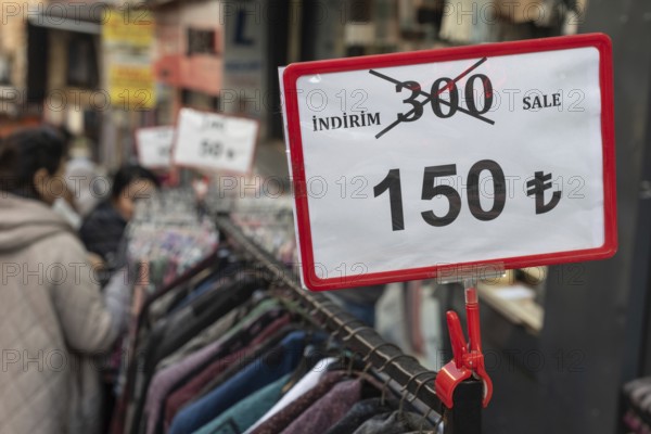 Istanbul, Turkey 7th January 2025. Local Turkish shoppers browsing clothes reduced in price in a popular textile bazaar in the Fatih district of Istanbul, Turkey