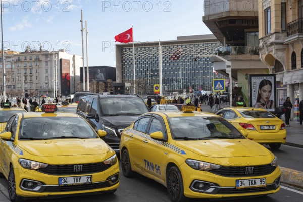 Istanbul, Turkey. January 3rd 2025. Yellow Turkish taxi cabs in busy traffic around Taksim square, Istiklal street, central Istanbul, Turkey