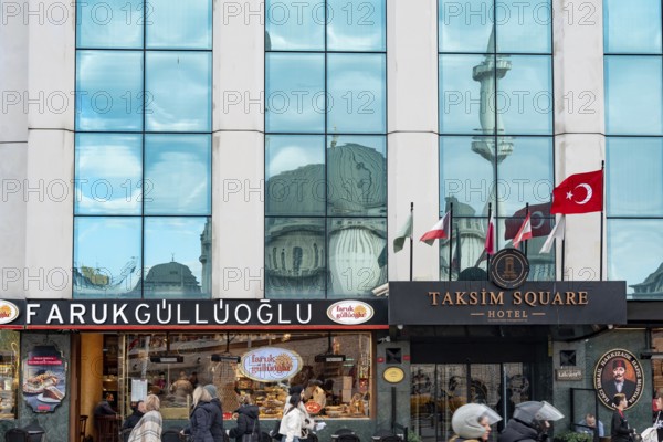 Istanbul, Turkey. January 3rd 2025. Farukgulluoglu Sweet shop and the Taksim Square Hotel at the entrance to the busy Istiklal shopping street, Istanbul, Turkey