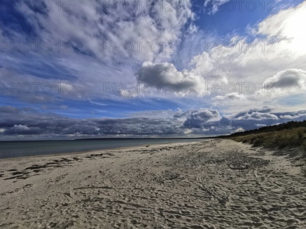 Dynamic clouds over wide, sandy beach, Rügen, Baltic Sea