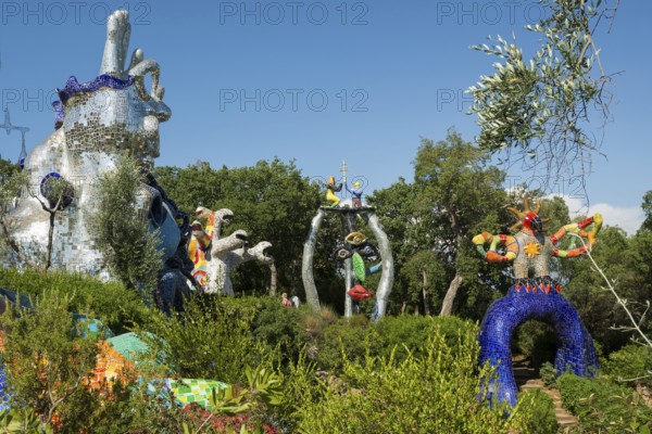 Colourful sculptures made of glass and mirrors, Giardino dei Tarocchi, Garden of Tarot, by Niki de Saint Phalle, near Capalbio, Province of Grosseto, Tuscany, Italy