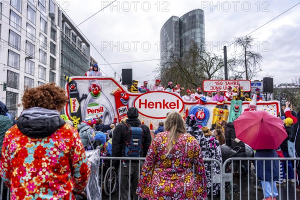 Rose Monday procession in Düsseldorf, theme car from companies, here chemical company Henkel, at the street carnival, in some heavy rain, North Rhine-Westphalia, Germany
