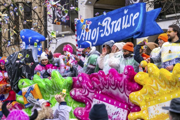 Rose Monday procession in Düsseldorf, theme car from companies, here confectionery manufacturer Ahoj, effervescent, at the street carnival, sometimes in heavy rain, North Rhine-Westphalia, Germany