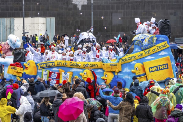 Rose Monday procession in Düsseldorf, theme car from companies, here wholesale company Metro, at the street carnival, in some heavy rain, North Rhine-Westphalia, Germany