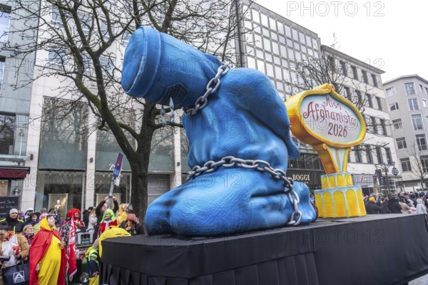 Rose Monday procession in Düsseldorf, theme car by wagon manufacturer Jacques Tilly, theme woman's rights in Afghanistan, Miss Afghanistan, in burqa and chains, against the Taliban regime, North Rhine-Westphalia, Germany