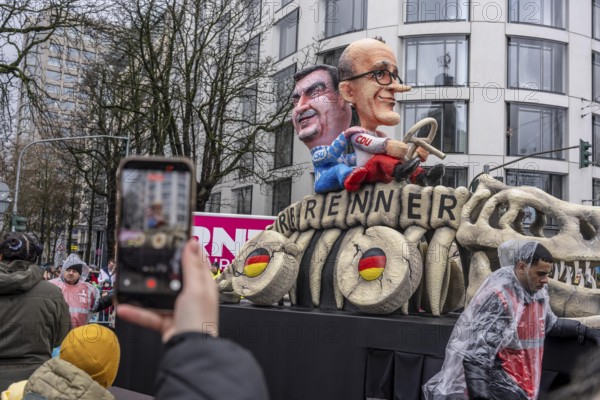 Rose Monday procession in Düsseldorf, theme cars by wagon manufacturer Jacques Tilly, Merz and Söder ride a combustion fossil, fight against an EU-wide combustion stop for vehicles, North Rhine-Westphalia, Germany