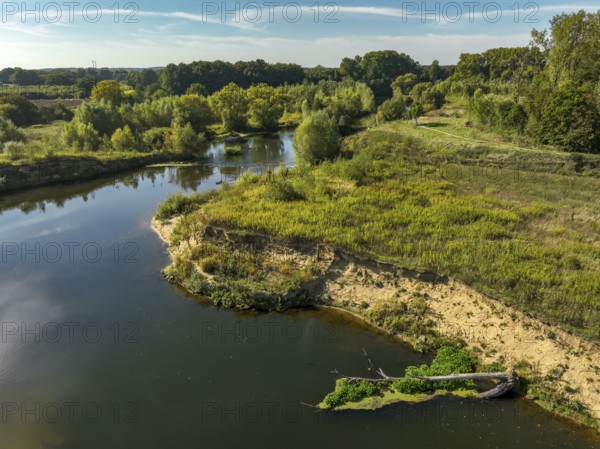 Datteln, North Rhine-Westphalia, Germany - Lippe, river and floodplain development of the Lippe near Haus Vogelsang, a near-natural river landscape was created here, an intact river-floodplain ecosystem restored with flood protection through redesigned flooded areas. The new Lippe loop has created an extensive floodplain landscape that provides valuable habitat for animal and plant species. Deadwood inserted at the front