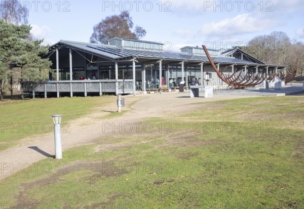 The King's River Café and visitor centre Sutton Hoo, Woodbridge, Suffolk, England, UK and sculpture of Anglo-Saxon ship