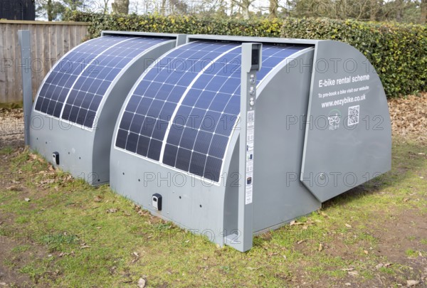 Two EEZYPODS secure, solar-powered e-bike charging and storage units operated by the UK-based company EEZYBIKE, UK