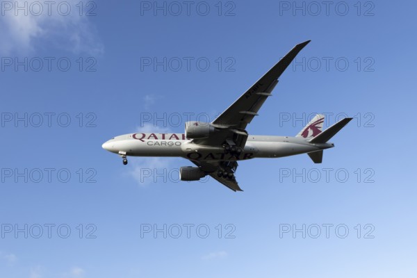 Boeing 777 A7-BFL commercial jet aircraft of Qatar cargo in flight on approach to land at London Stansted airport, Essex, England, United Kingdom
