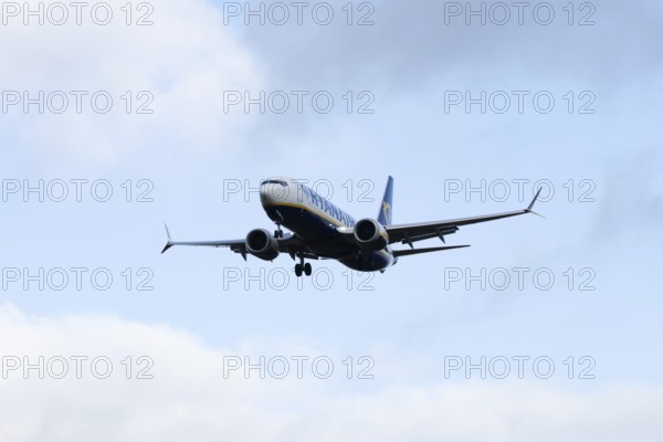 Boeing 737 commercial passenger airliner jet aircraft of Ryanair airways in flight on approach to land at London Stansted airport, Essex, England, United Kingdom