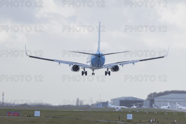 Boeing 737 commercial passenger airliner jet aircraft of Ajet airways in flight on approach to land at London Stansted airport, Essex, England, United Kingdom