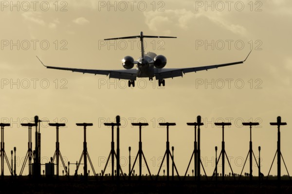 Gulfstream executive business jet aircraft in flight on approach to land at sunset at London Stansted airport, Essex, England, United Kingdom