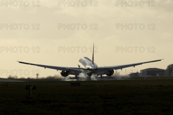 Boeing 777 A7-BFL commercial jet aircraft of Qatar cargo in flight landing on the runway at London Stansted airport, Essex, England, United Kingdom