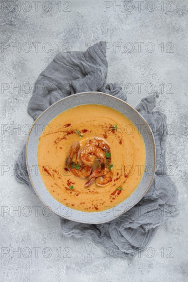 Pumpkin cream soup with shrimp, herbs and spices, homemade, no people
