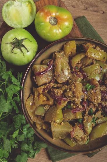 Fried green tomatoes, with onions and spices, green tomato appetizer, Georgian cuisine, homemade, no people