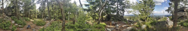 Panoramic view of a dense forest with trees and some rocks, Franconian mountain trail, hiking in the Fichtelgebirge nature park Park