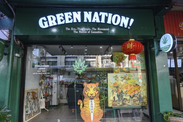 Green Nation shop for Legal cannabis and marijuana products store selling Thai weed and CBD and medicinal drugs, Bangkok, Thailand, Asia, In Thailand, cannabis, known by the name Ganja, is currently decriminalized. However, cannabis extracts and products are officially limited to 0.2% THC content. Purchase is permitted only from licensed dispensaries. While recreational use is allowed, public consumption remains prohibited. Neon weed signs have become ubiquitous in Bangkok's busy tourist areas, with dispensaries cropping up on every corner. Yet there are rumours a more conservative government could reverse the legal ruling