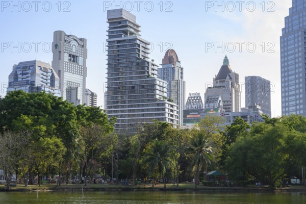 Bangkok, Thailand. March 4th 2025. A rare urban green space in the city centre, high rise modern buildings surrounding Lumphini Park, Bangkok