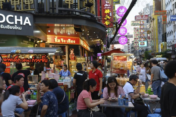 Bangkok, Thailand. February 18th 2025. Busy evening crowds at popular street food stalls along Yaowarat Road, Chinatown, Bangkok, Thailand