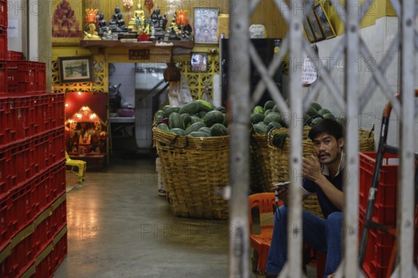 Bangkok, Thailand. March 2rd 2025. A Thai worker inside Pak Khlong Talat-Bangkok Flower Market, a busy wholesale market that works 24 hours a day