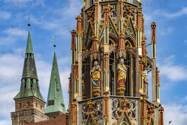 The Beautiful Fountain on the Main Market Square and the Towers of St. Sebaldus Church, Nuremberg, Bavaria, Germany
