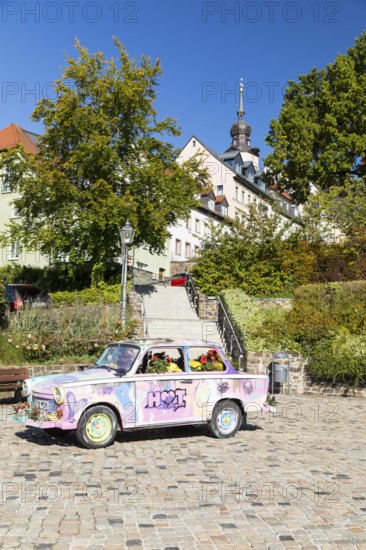 Colourfully painted and planted Trabant car on the old market in Hohenstein-Ernstthal, Saxony, Germany